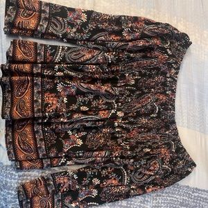 Boho shirt, flared ends,stretches from the top section,could be worn offshoulder